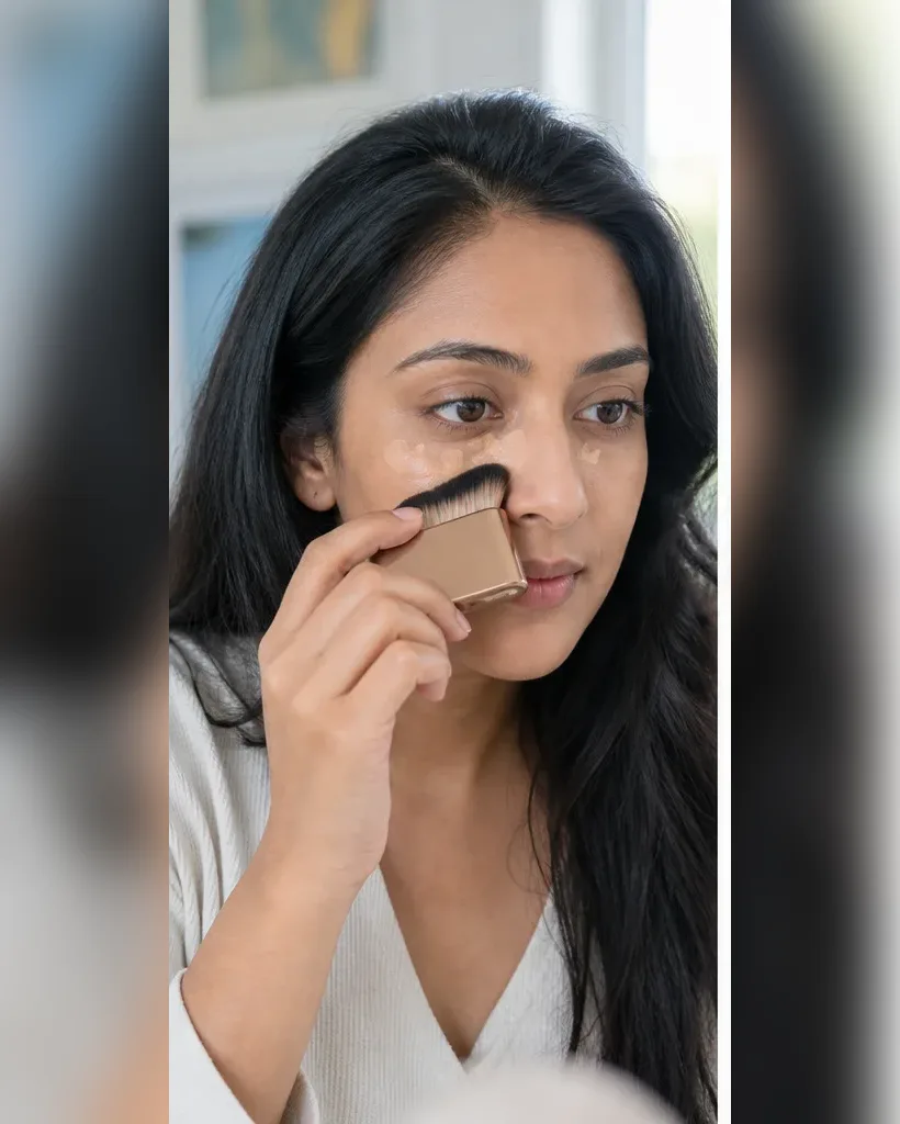 Model using a complexion blending brush